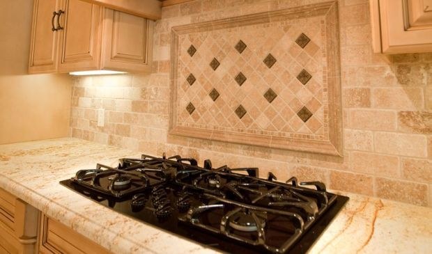 Cooktop with a travertine mosaic inset, by Roman Marble Shop