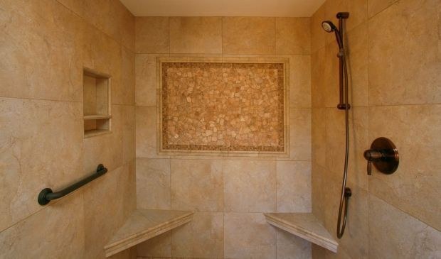 Travertine shower with a mosaic niche, by Roman Marble Shop